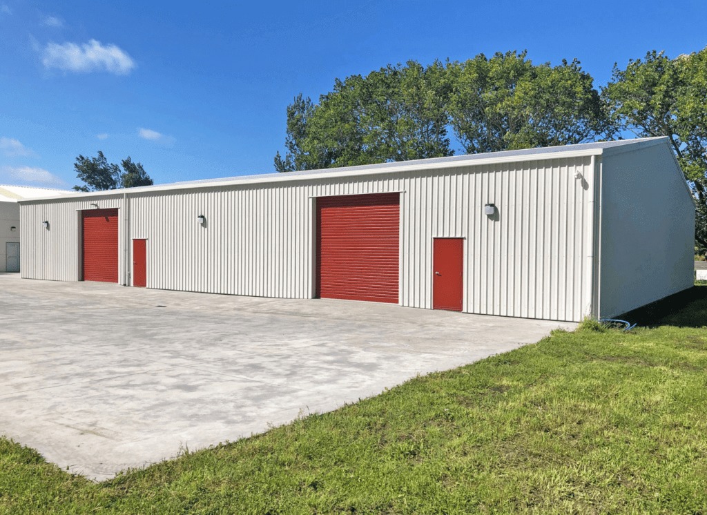 red and white industrial workshop shed by kiwispan