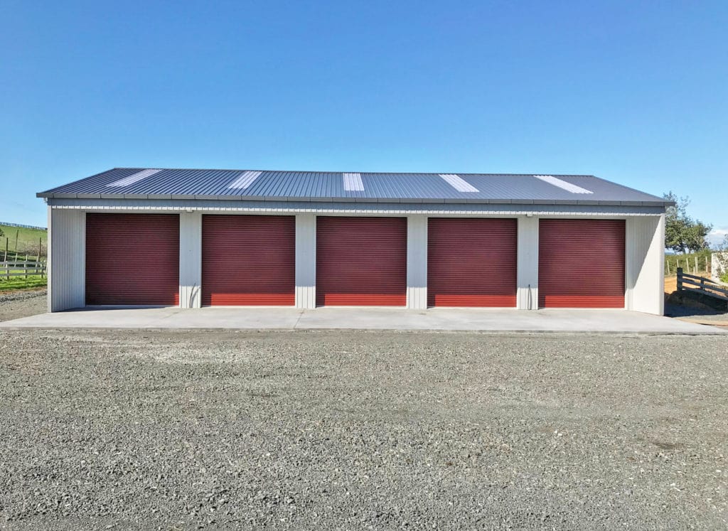 red and white large farm storage shed by kiwispan builders