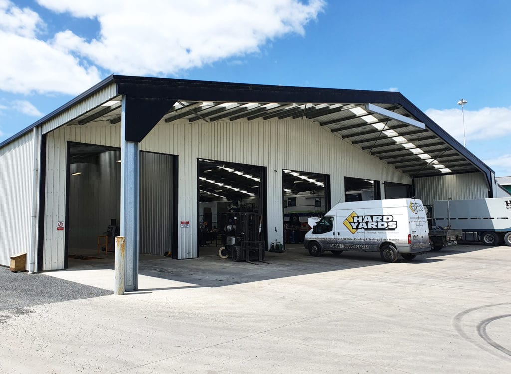 commercial building with metal canopy shelter by kiwispan