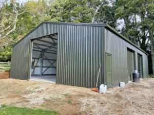 green farm storage shed for equipment by kiwispan