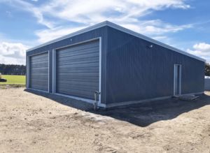 custom-built steel two bay garage shed by kiwispan