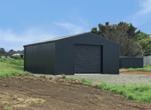 black garage shed built by kiwispan on farm setting