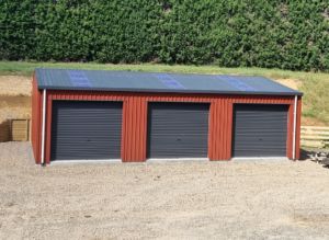 three bay farm shed with red paint