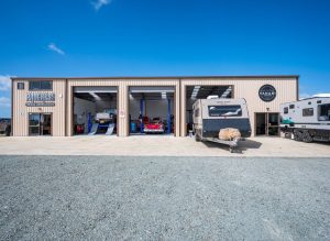 KiwiSpan made commercial steel shed with camper vans in garage bays